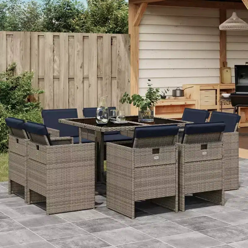 vidaXL terrastafelset, 8-delige grijze rotan eettafel voor buiten met marineblauwe stoelen met kussens
