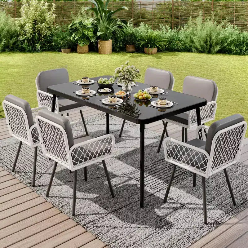 7-delige eettafelset voor buiten met grijze kussens, tafel met blad van gehard glas en weerbestendige PE-wickerstoelen voor terras, tuin of zwembad